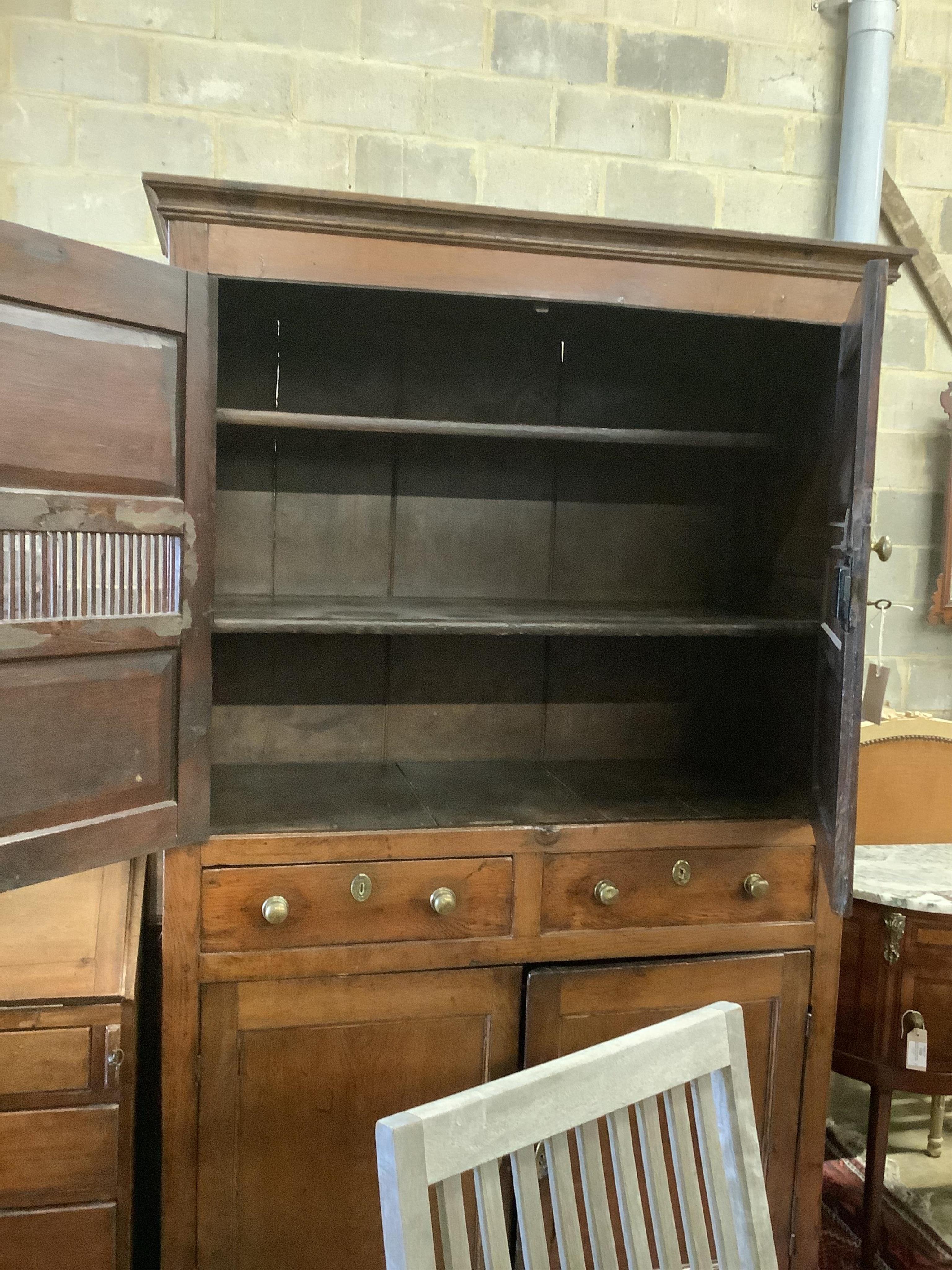 A late 18th century oak cupboard, width 113cm, height 186cm. Condition - fair to good